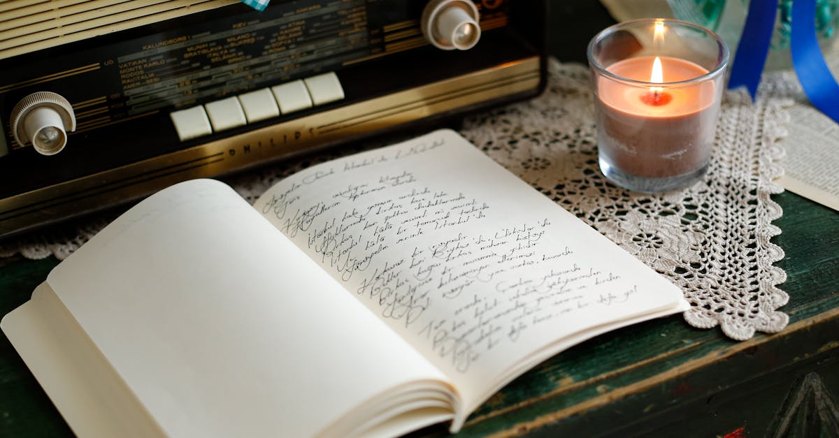 A vintage radio, candle, and journal create a nostalgic and cozy atmosphere indoors.